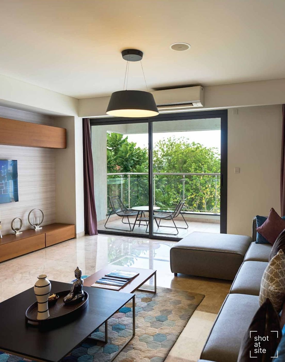 Living and dining area opening to a balcony