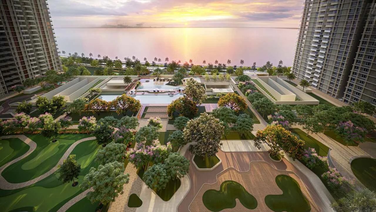 Landscaped podium gardens and pools facing the backwaters at sunset